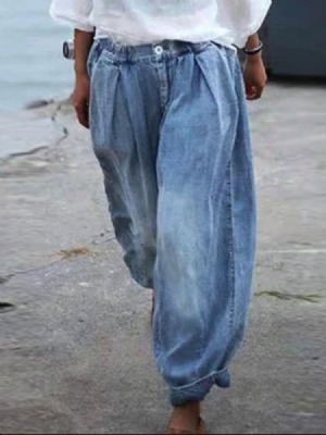 Calça Jeans Mulher Com Botão Largo E Pernas Largas